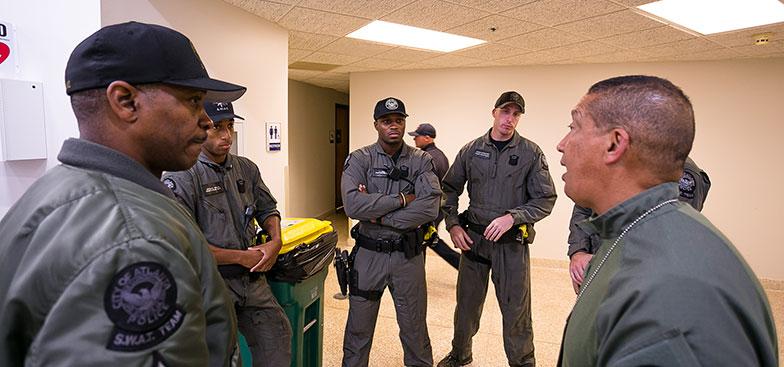 members of the 91 Public Safety department in a discussion 